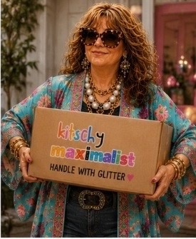Stacie holding a Kitschy Maximalist box that says Handle with Glitter